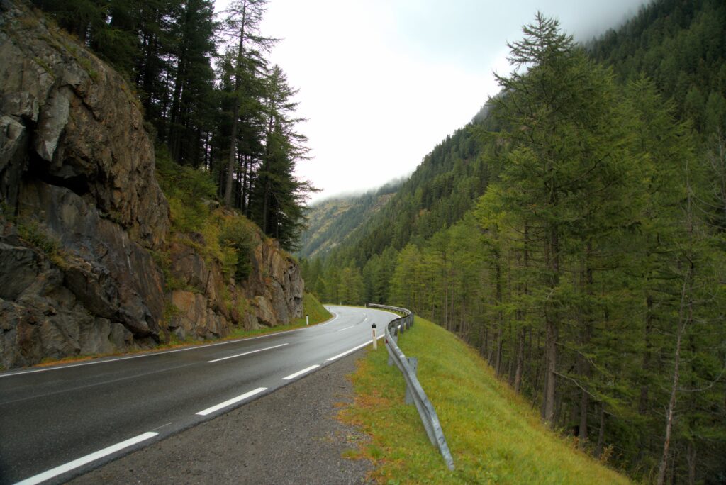 Explore the misty mountain roads and lush forests of the Tyrolean Alps in Austria.